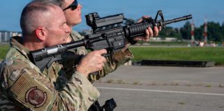 U.S. Air Force Lt. Col. Shane Watts, 51st Security Forces Squadron commander, aims a rifle equipped with a Smart Shooter SMASH optic during Exercise Dragon Flight at Osan Air Base, Republic of Korea, Aug. 6, 2026. The Smart Shooter rifle is equipped with a Smash 2000 optic designed to make rifles more accurate and lethal for drones and rotary wing aircraft to effectively take out a target in a single shot. (U.S. Air Force photo by Senior Airman Rome Bowermaster)